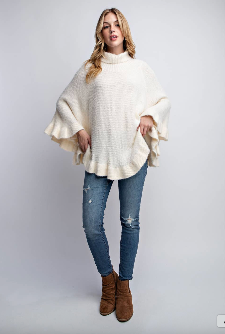 DIVA COZY RUFFLE HEM PONCHO SWEATER
