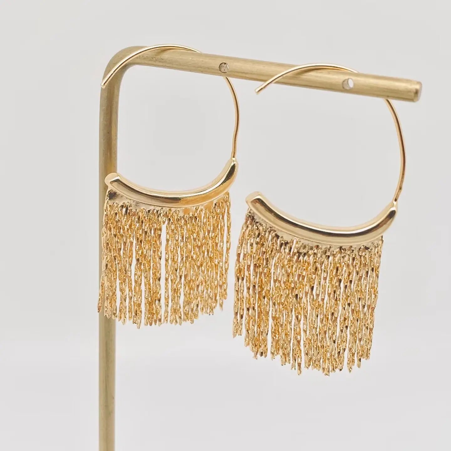 GOLD TASSEL LOOP EARRINGS